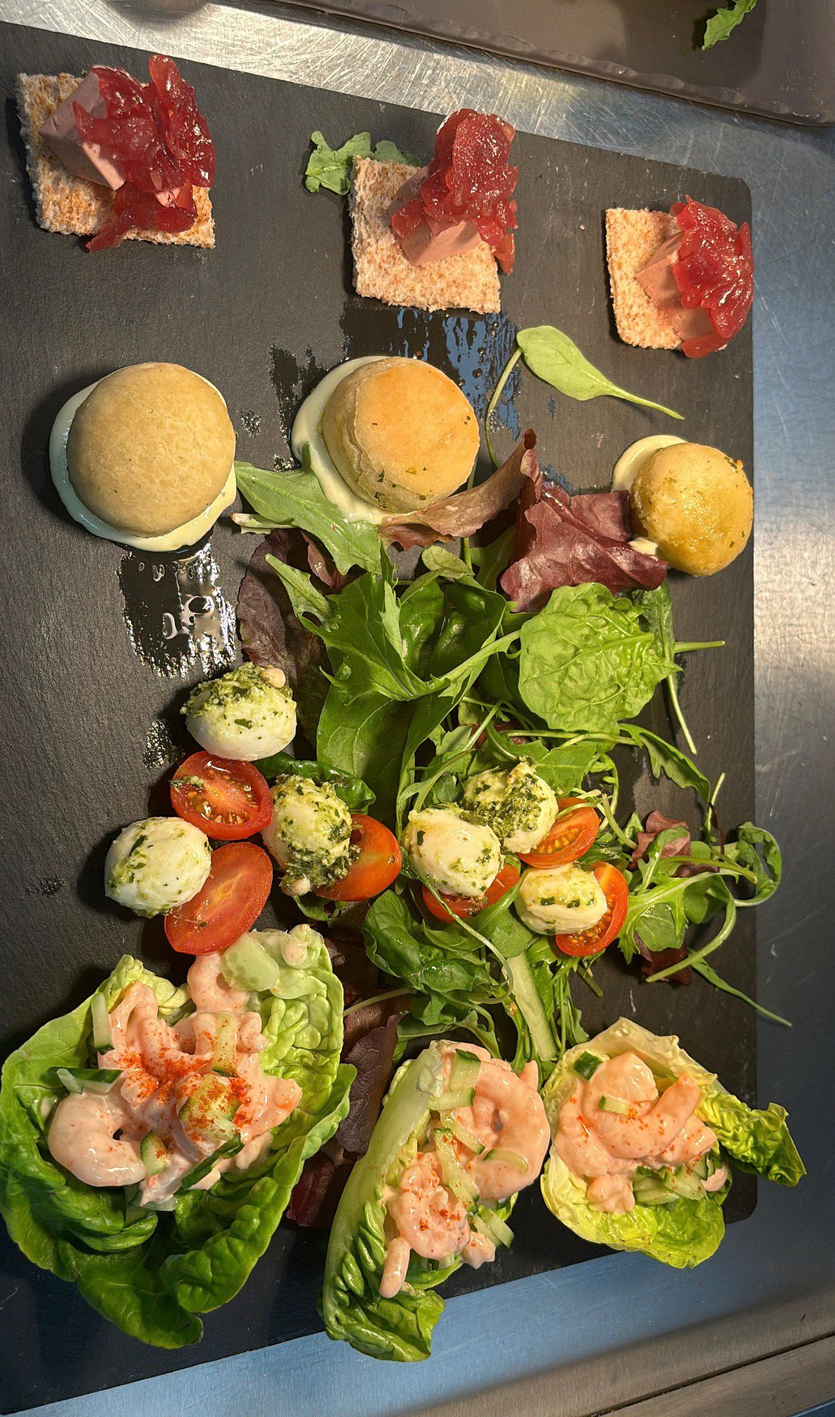 Slate canapé board with pâté, prawn cocktail and bocconcini