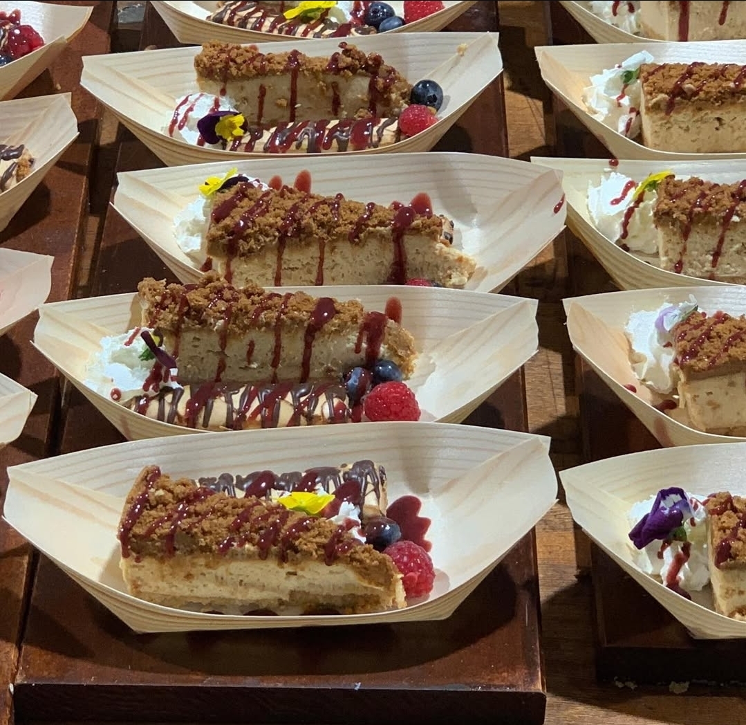Cheesecake dessert boats with berries and drizzle