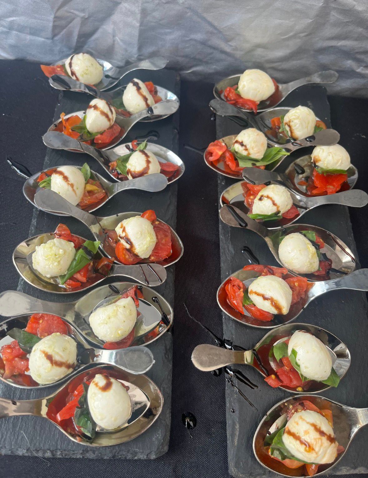 Caprese tasting spoons with mozzarella and tomato