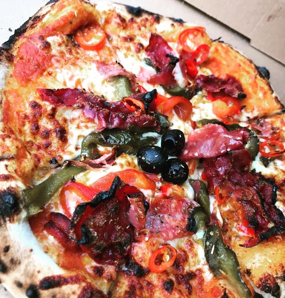 Spicy salami pizza with peppers and olives